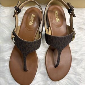 MICHAEL Michael Kors Brown Logo T-Strap Sandals with Gold Accents